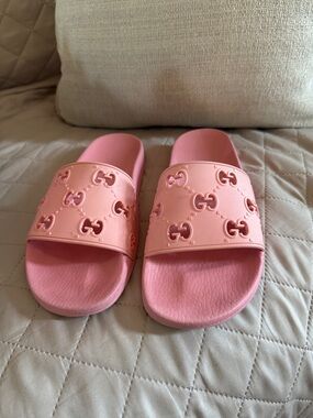 Gucci women GG Embossed Slide Sandals